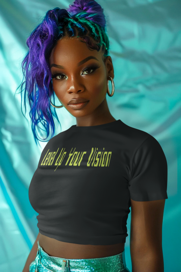 Model wearing a black triblend t-shirt with the Level Up Your Vision motivational design, styled casually to highlight its luxurious look and comfortable fit, available in sizes S-3XL.