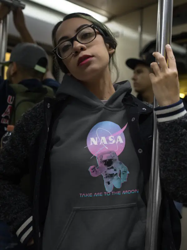 Woman with glasses on a subway wearing Gray - NASA Take Me To The Moon Fleece Hoodie