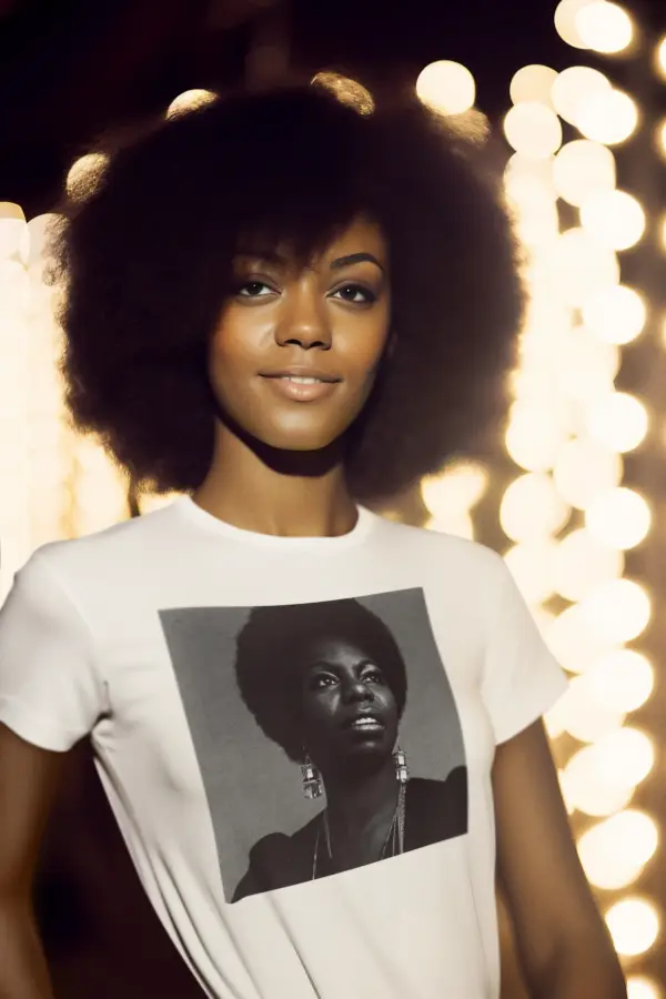 Young woman wearing a white Nina Simone Perspective Triblend T-Shirt