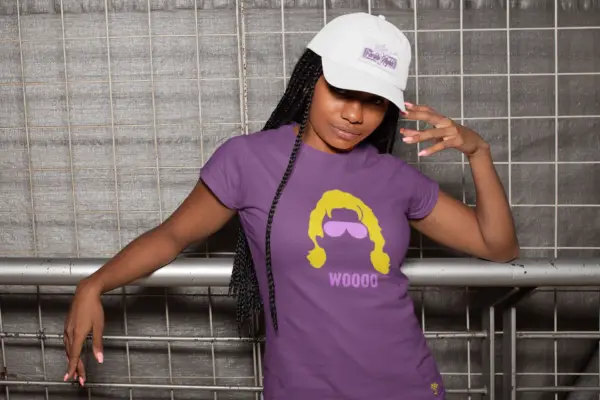 Young woman wearing white hat and purple Ric Flair Woooo t-shirt