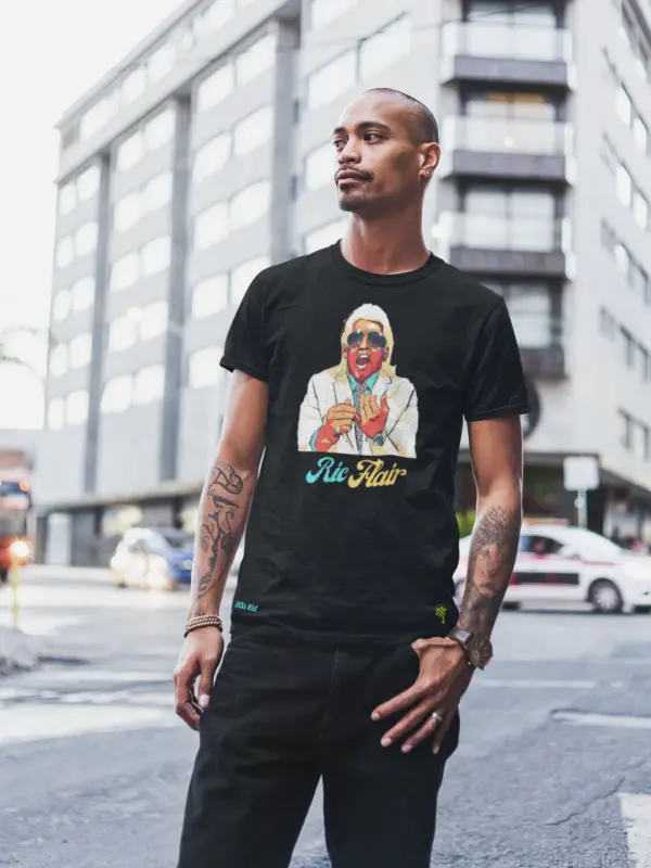 Young man standing on the street wearing black Ric Flair t-shirt