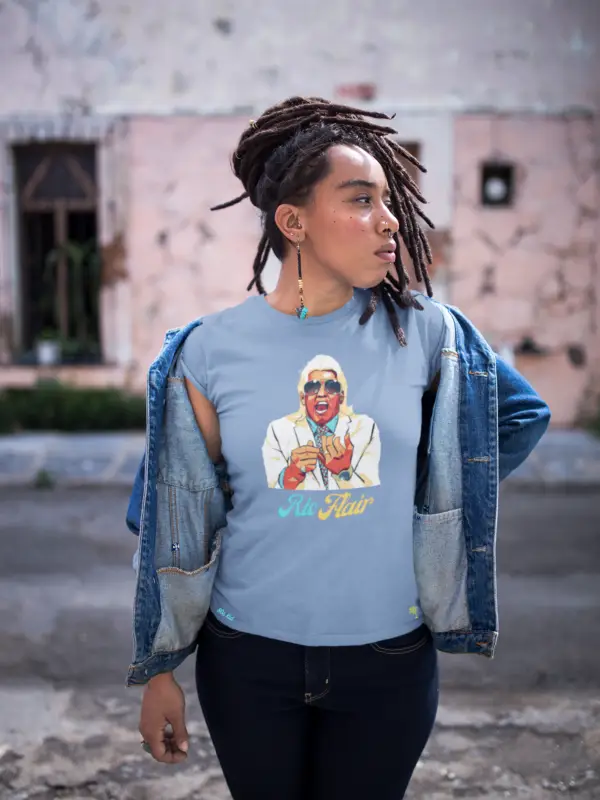 Young woman with dreads wearing denim colored Ric Flair t-shirt and jacket.