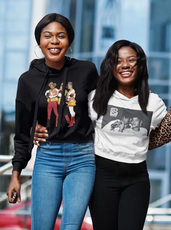 Women wearing cropped black salt-n-pepa and white salt-n-pepa hoodies respectively.