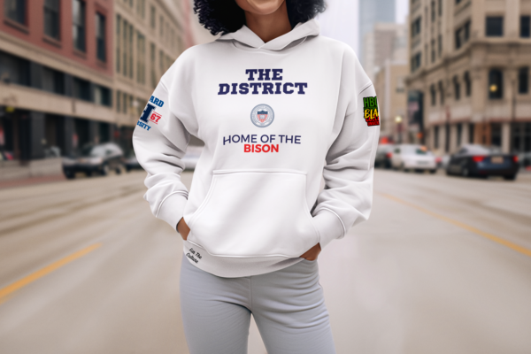 Woman standing in the street wearing a White - Howard University - The District - Fleece Hoodie