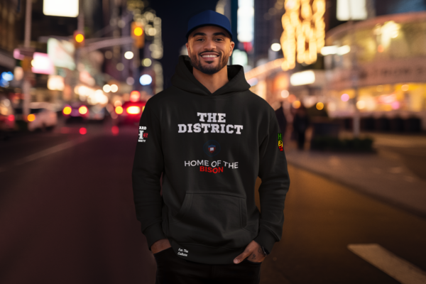 Man standing in the street wearing a black - Howard University - The District - Fleece Hoodie