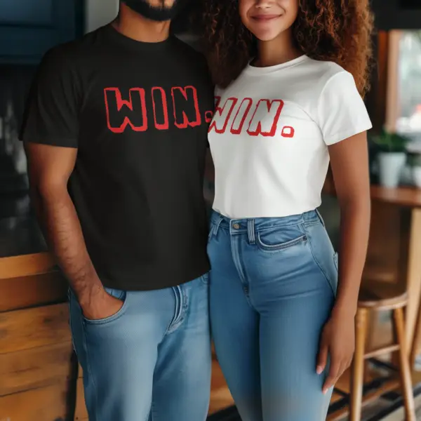 Models wearing a black and white triblend t-shirt with the bold Win; design, styled casually to highlight its luxurious look and comfortable fit, available in sizes S-3XL."