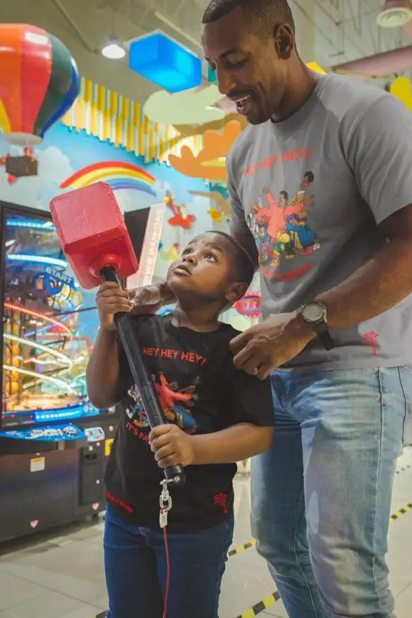 man and young boy wearing gray and black fat albert tees