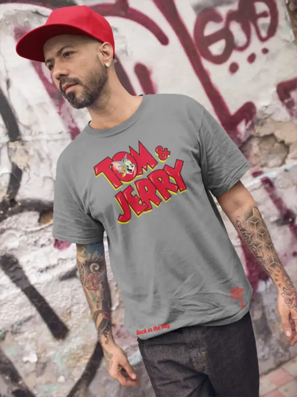 Man with red hat wearing a gray Tom & Jerry triblend t-shirt