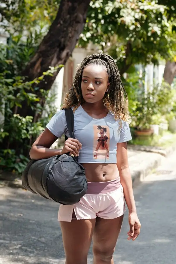 Young woman with braids wearing a Denim - Lauryn Hill Early Days Crop Top