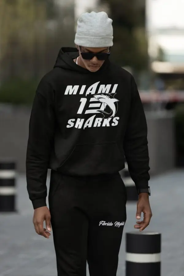 Young man with shades wearing a Black - Miami Sharks - Willie Beamen Fleece Hoodie