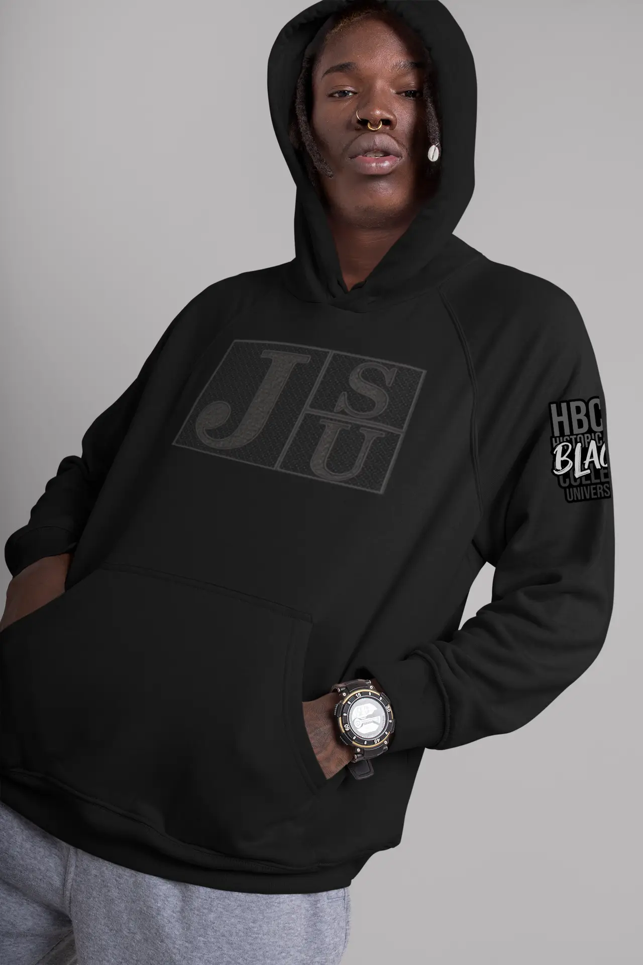 Young man wearing a black-on-black JSU HBCU hoodie